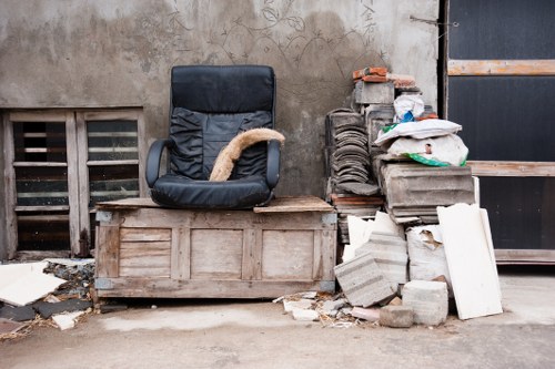 Business professionals managing waste removal in an office setting in Eltham