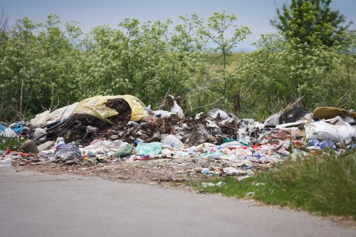 Operatives following safety procedures during waste handling