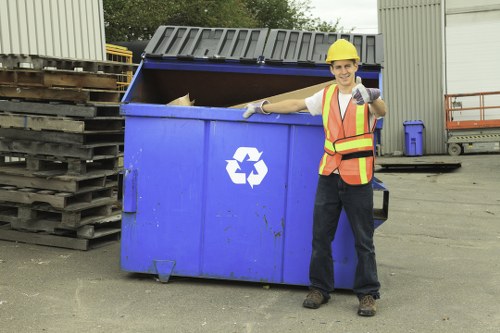 Workers sorting recyclables at a local transfer station